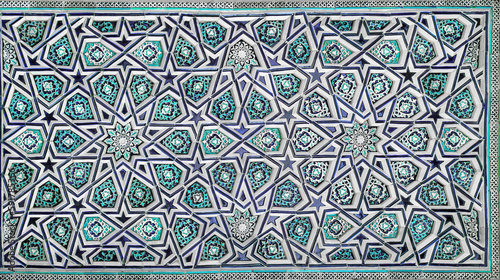 Geometric traditional Islamic ornament. Fragment of a ceramic mosaic. photo