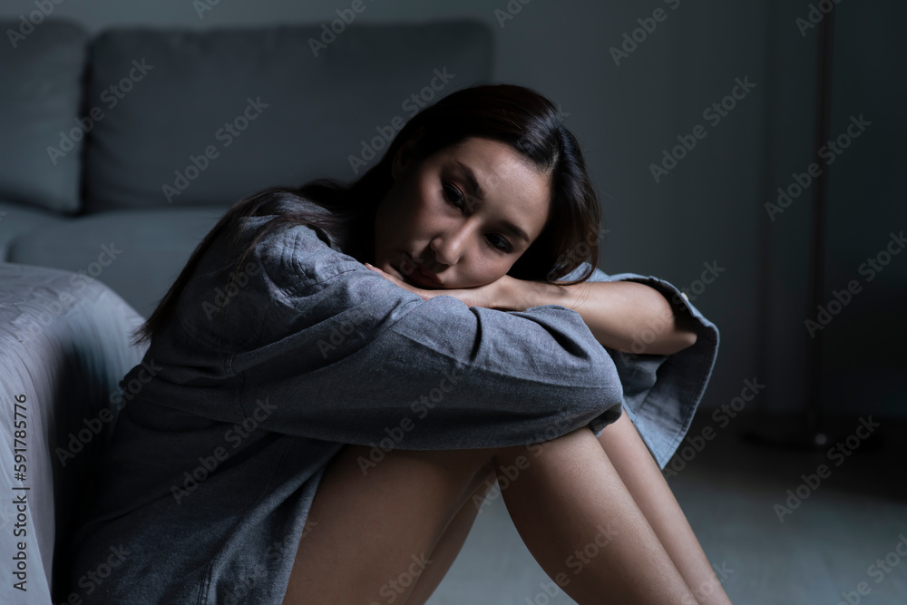 Young Asian woman in bedroom feeling sad tired and worried suffering depression in mental health Young Asian woman in bedroom feeling sad tired and worried suffering depression in mental health