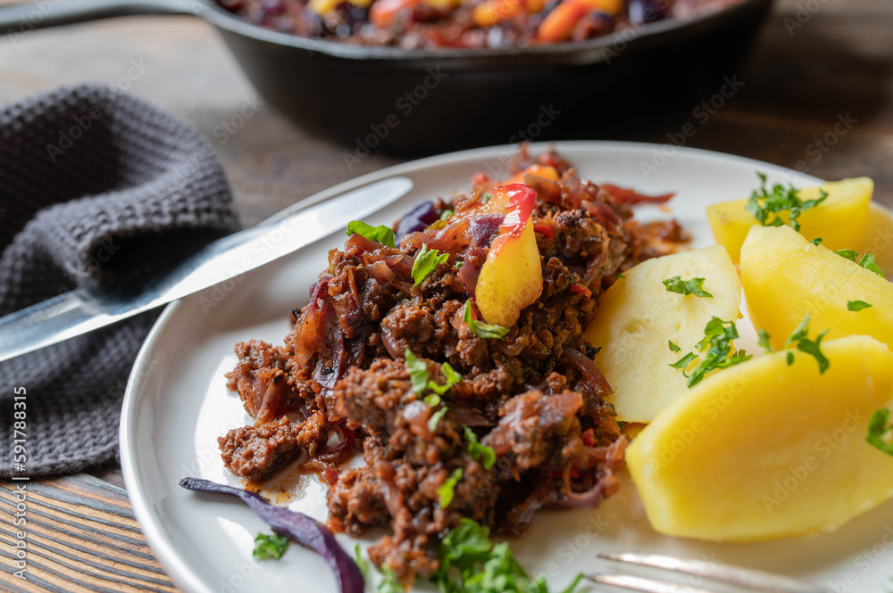 One pot ground beef red cabbage skillet with potatoes and sauteed apples on a plate One pot ground beef red cabbage skillet with potatoes and sauteed apples on a plate
