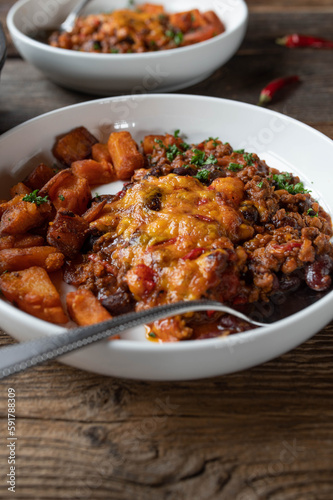 Mexican bean stew with cheddar cheese crust and sweet potatoes