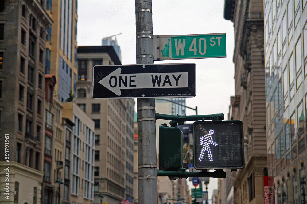 West 40th Street green traffic sign in New York between the skyscrapers