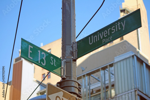 Green East 13th Street and University Place traditional sign in Midtown Manhattan © willeye