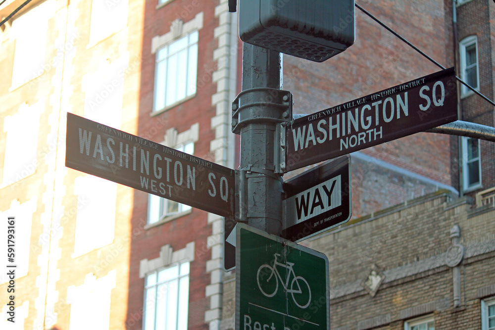 Naklejka premium Brown Washington Square North and Washington Square West historic sign in Midtown Manhattan in New York City in Greenwich Village Historic District