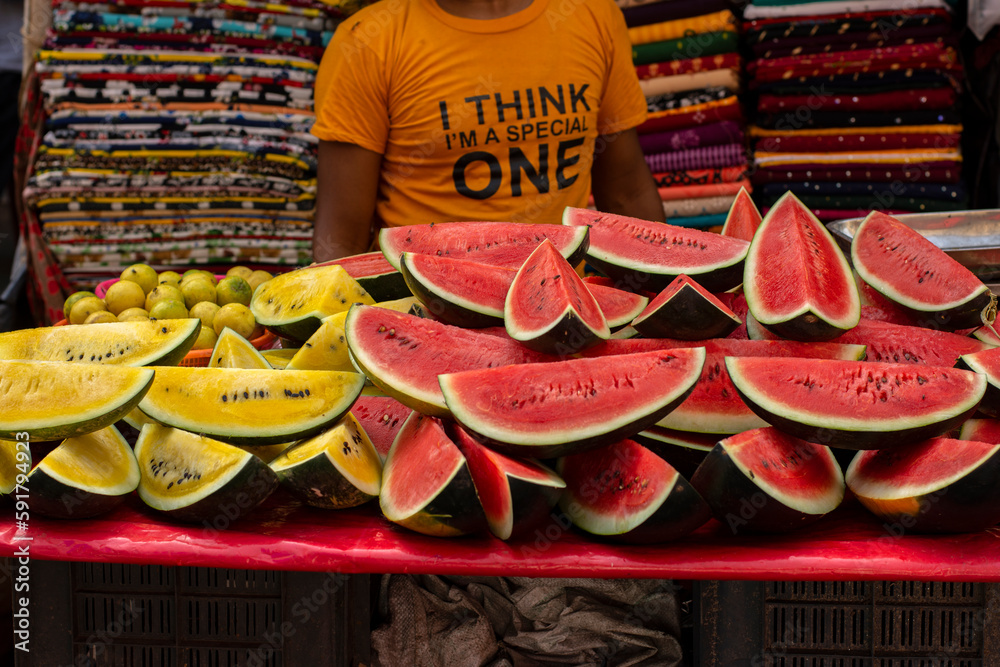 A man of muslim religion selling watermelon fruits at the Zakaria street at the time of Ramadan.