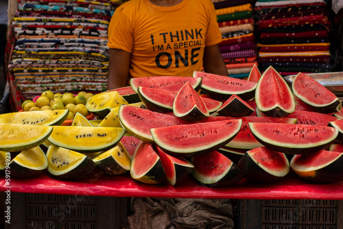 A man of muslim religion selling watermelon fruits at the Zakaria street at the time of Ramadan. photo