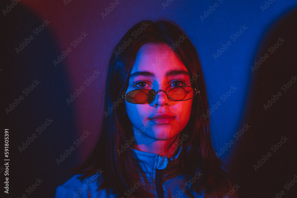 stylized portrait of a young girl with modern glasses using 2 sources of colored light stylized portrait of a young girl with modern glasses using 2 sources of colored light
