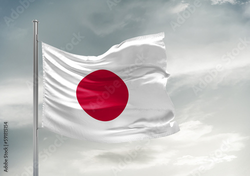 Free Download Japan national flag cloth fabric waving on beautiful sky Background. - GFXLoad