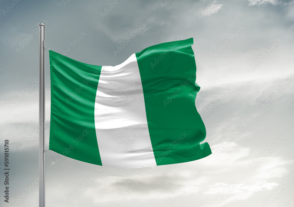 Nigeria national flag cloth fabric waving on beautiful sky Background.
