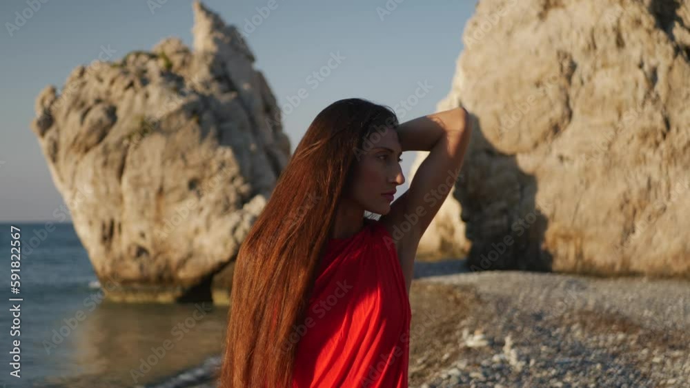 Closeup of a Caucasian woman standing near the sea Closeup of a Caucasian woman standing near the sea