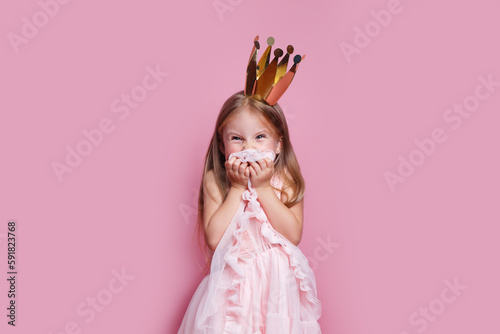 naughty little girl in a fancy dress and a crown did something bad