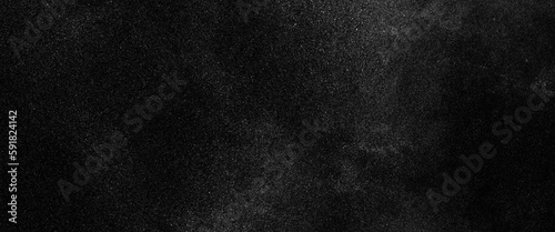 Abstract splashes of water on black background. Freeze motion of white particles, abstract splashes of milk on a black background, dust overlay textured. Grain noise particles. Snow effects pack. 