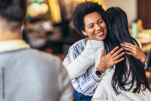 Support group patients hug each other during the therapy session. Group therapy session, addiction treatment or team building.