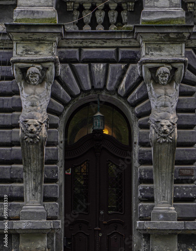 Old facade with atlas statues 