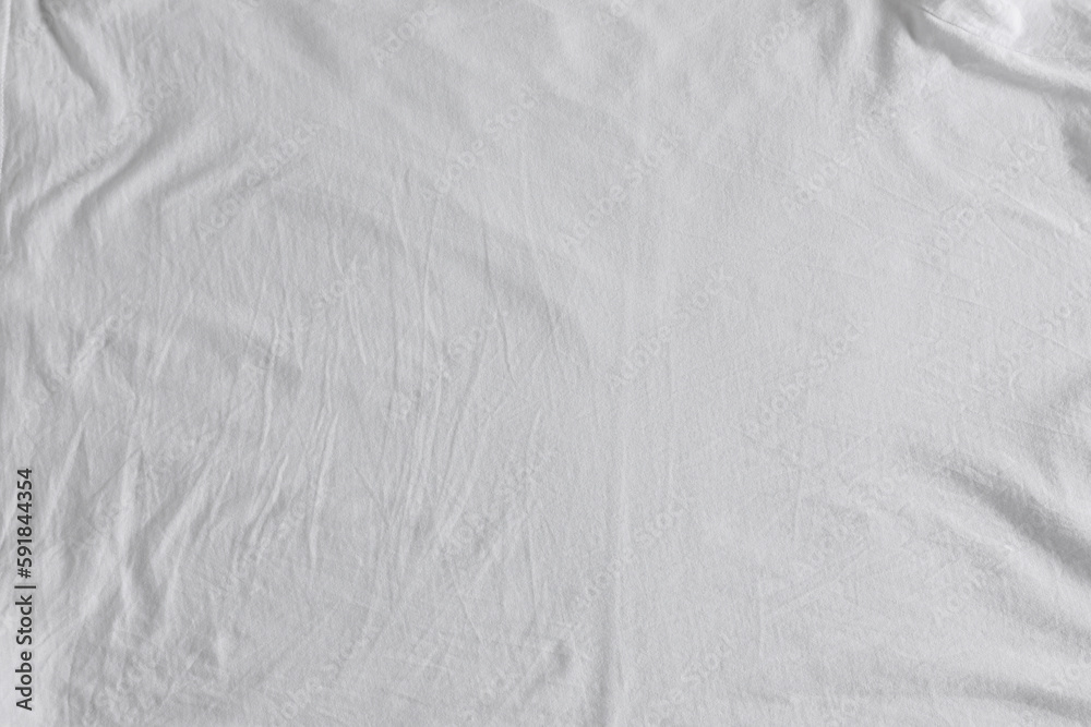 Naklejka premium Crumpled white fabric as background, top view