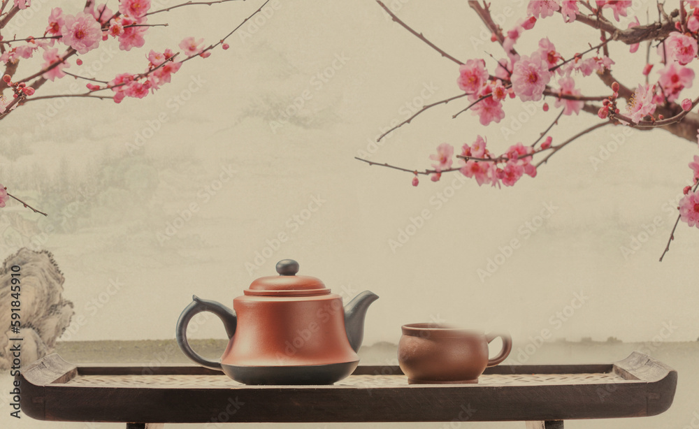 Teapot on peach blossom background