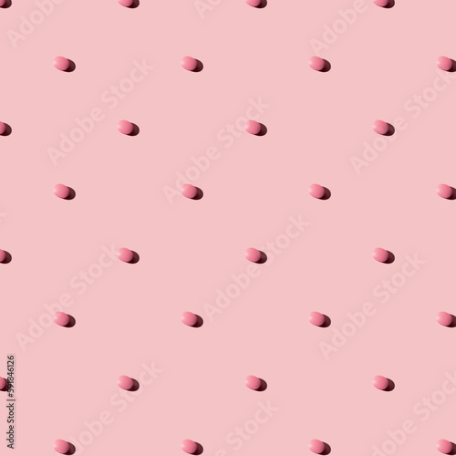 Pink pills on a pink  background. Seamless pattern for the background. Medical pharmacy flat lay design for presentation packaging, website, flyer, cover business cards.