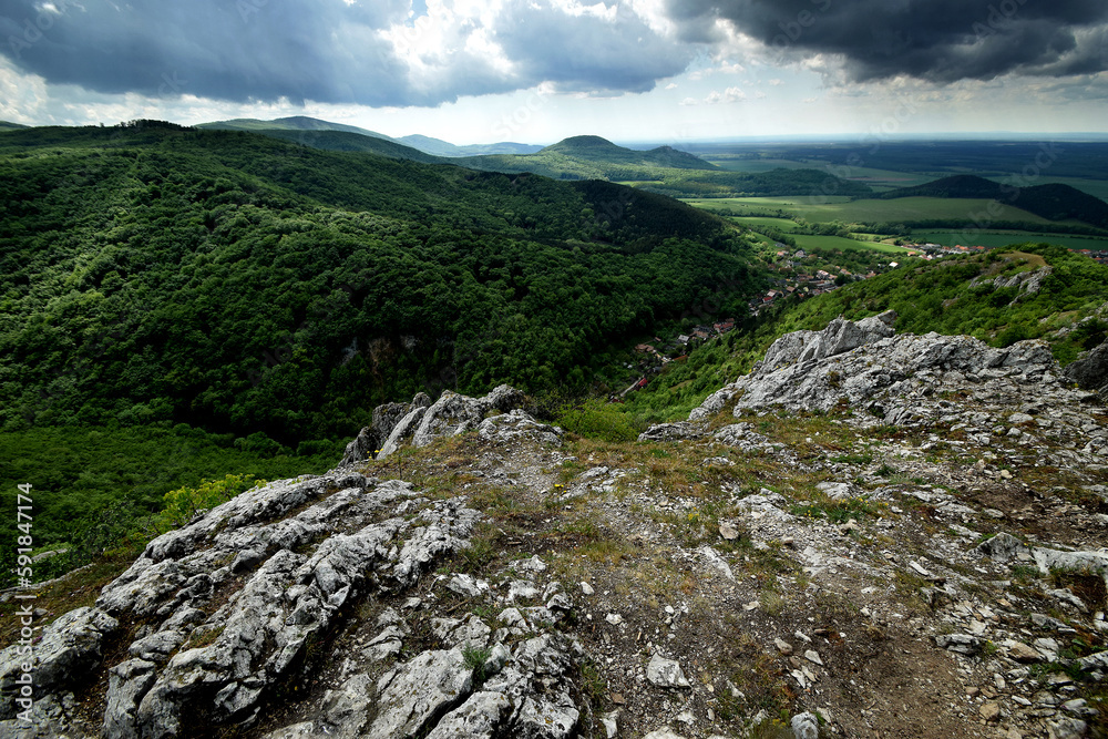 Beautiful view of cliffs and green covered hills Beautiful view of cliffs and green covered hills