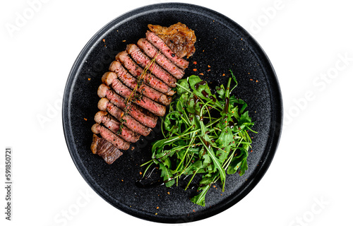 Sliced sirloin steak, marbled beef meat with arugula.  Isolated, transparent background
