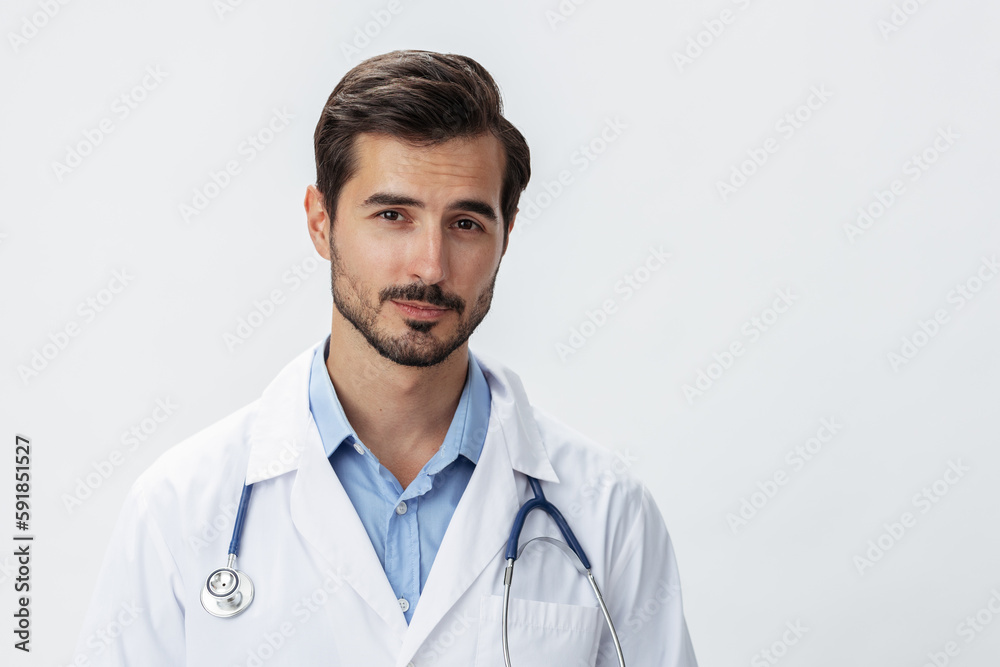 Man doctor in white coat with stethoscope and eyeglasses on white isolated background looking into camera, copy space, space for text, health Man doctor in white coat with stethoscope and eyeglasses on white isolated background looking into camera, copy space, space for text, health