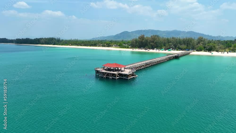 Aerial view of The jetty leads out to the sea with blue sky scene in summer tropical background Aerial view of The jetty leads out to the sea with blue sky scene in summer tropical background