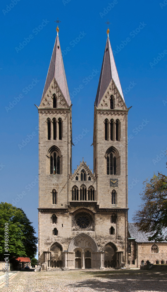 Elevation of Halberstadt cathedral with bell towers and gothic portal on its western facade, Sachsen-Anhalt in Germany