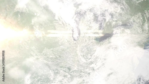 Earth zoom in from outer space to city. Zooming on Merrillville, Indiana, USA. The animation continues by zoom out through clouds and atmosphere into space. Images from NASA photo