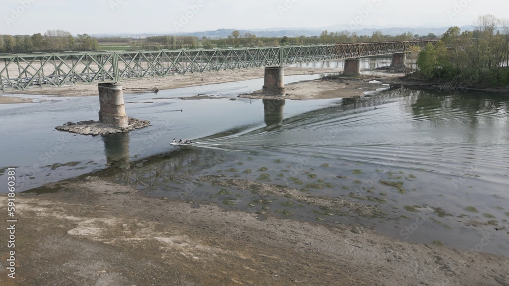 Europe, Italy, Pavia Drought and aridity river - Po and Ticino , dry beach of sand and water shortage, water emergency in Lombardy - Drone view in Ponte della Becca - Climate change global warming