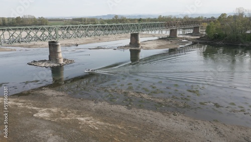 Obraz na płótnie Europe, Italy, Pavia Drought and aridity river - Po and Ticino , dry beach of sand and water shortage, water emergency in Lombardy - Drone view in Ponte della Becca - Climate change global warming w salonie