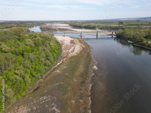 Wallpaper Mural Europe, Italy, Pavia  Drought and aridity river - Po and Ticino , dry beach of sand and water shortage, water emergency in Lombardy - Drone view in Ponte della Becca - Climate change global warming Torontodigital.ca