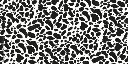 Seamless pattern with animal print dolmatian. Black spots. Suitable for printing and textiles.