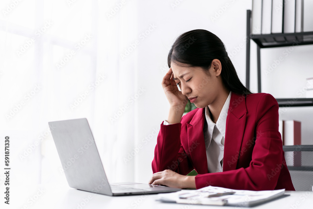 Businesswoman in suit stressful and headache while thoughtful ab Businesswoman in suit stressful and headache while thoughtful ab
