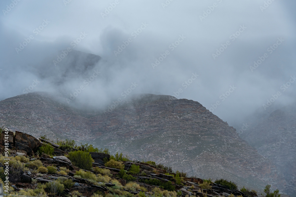 Swartberg Mountains in wild and windy overcast conditions. Near Klaarstroom and De Rust. Western Cape. South Africa