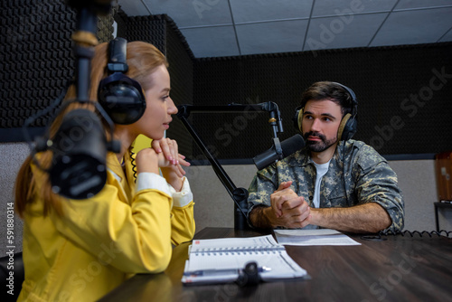 Two people talking in the live broadcasting on the radio