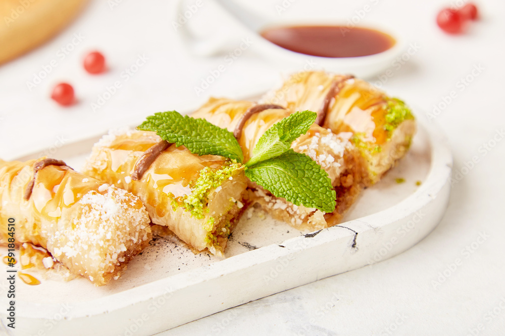 Traditional turkish delight of baklava with honey and mint. Natural sweets close up