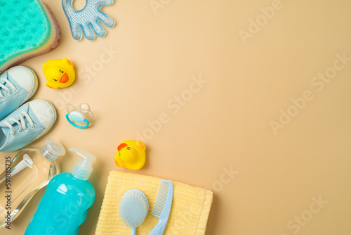 Baby bath and children health care products on modern background. Infant shampoo, duck toys and towel. Top view, flat lay