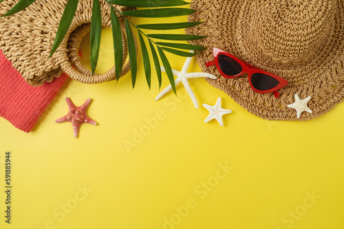 Summer holiday vacation background with fashion hat, bag and beach accessories. Top view from above