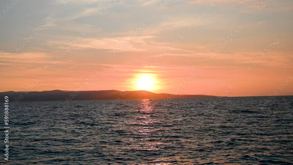 Colorful sunset above sea in summer. Sun is going down. Colorful sunset above sea in summer. Sun is going down.