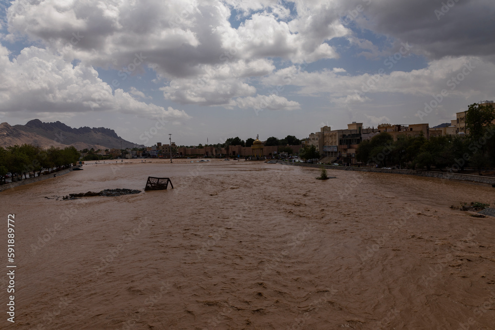 Nizwa, Oman - March 29 2023: Flowing Wadi in Nizwa, Oman Nizwa, Oman - March 29 2023: Flowing Wadi in Nizwa, Oman