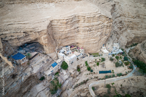 Israel. St. George Orthodox Monastery in Wadi Qelt in Judean desert around. Monastery of St. George of Choziba, Israel. The sixth-century cliff-hanging complex. photo