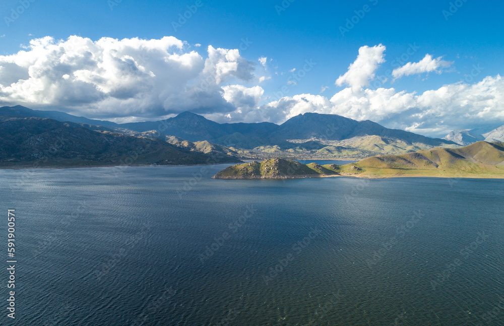 Isabella Lake in California. Beautiful Cloudy Sky and Mountain in Background. Bright Sunny Day. USA
