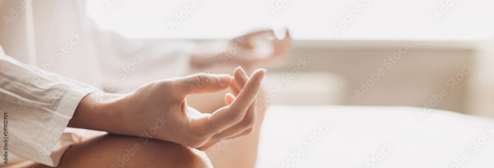 Yoga woman meditating and practicing yoga at home, banner. Recreation, self care, self acceptance, meditation, relaxation, healthy lifestyle, mindfulness concept - obrazy, fototapety, plakaty 