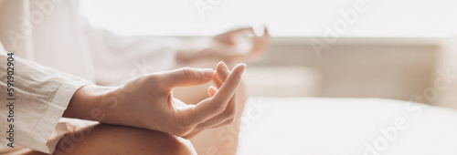 Quadro su tela Yoga woman meditating and practicing yoga at home, banner