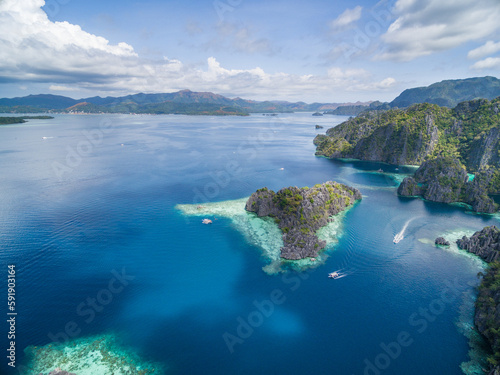 Twin Lagoon in Coron, Palawan, Philippines. Mountain and Sea. Lonely Boat. Tour A.