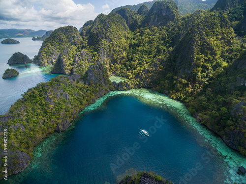 Single Boat in Coron, Palawan, Philippines. Sea and Mountain with Islands in Background