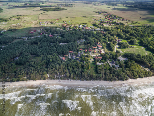 Baltic Sea in Lithuania. Karkle Town In Background photo