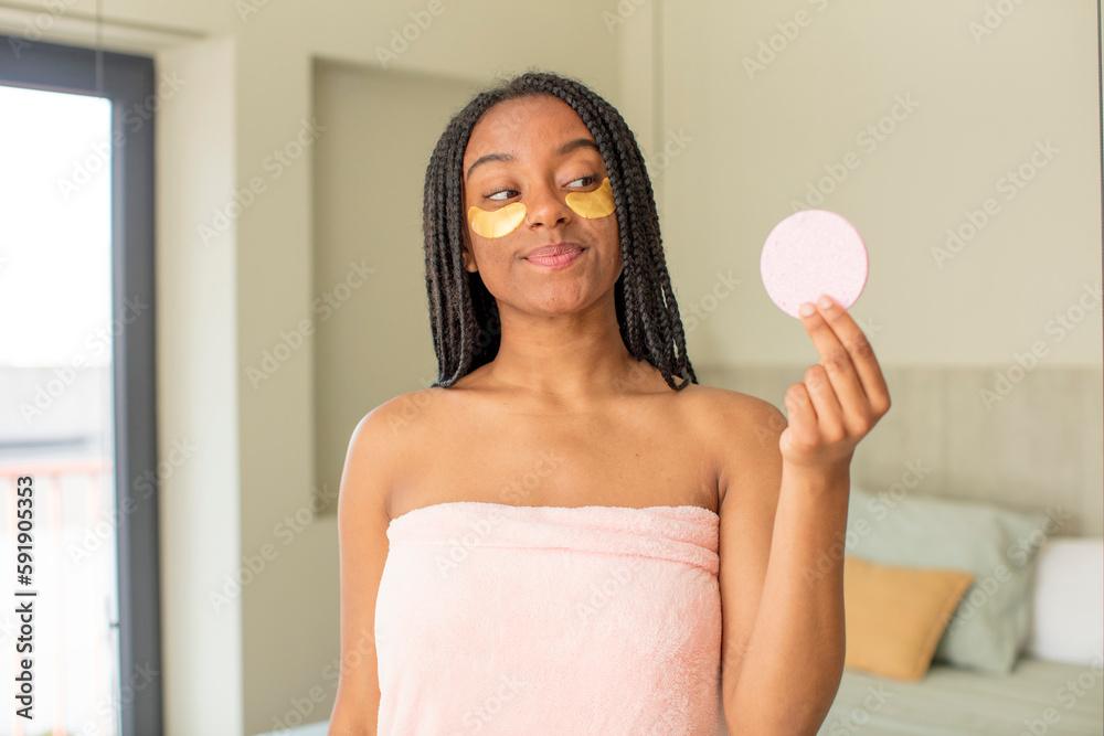 black afro woman smiling and looking with a happy confident expression. beauty concept black afro woman smiling and looking with a happy confident expression. beauty concept