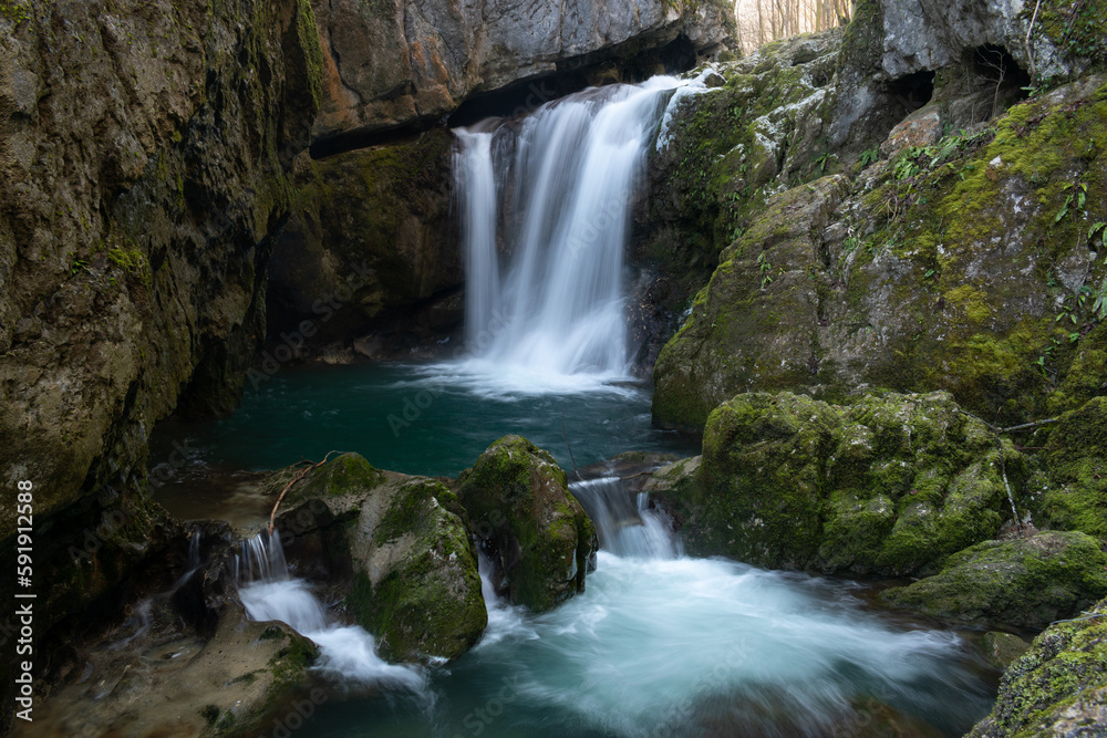 Waterfall with mossy rocks in forest, Svrakava waterfall near Banja Luka Waterfall with mossy rocks in forest, Svrakava waterfall near Banja Luka