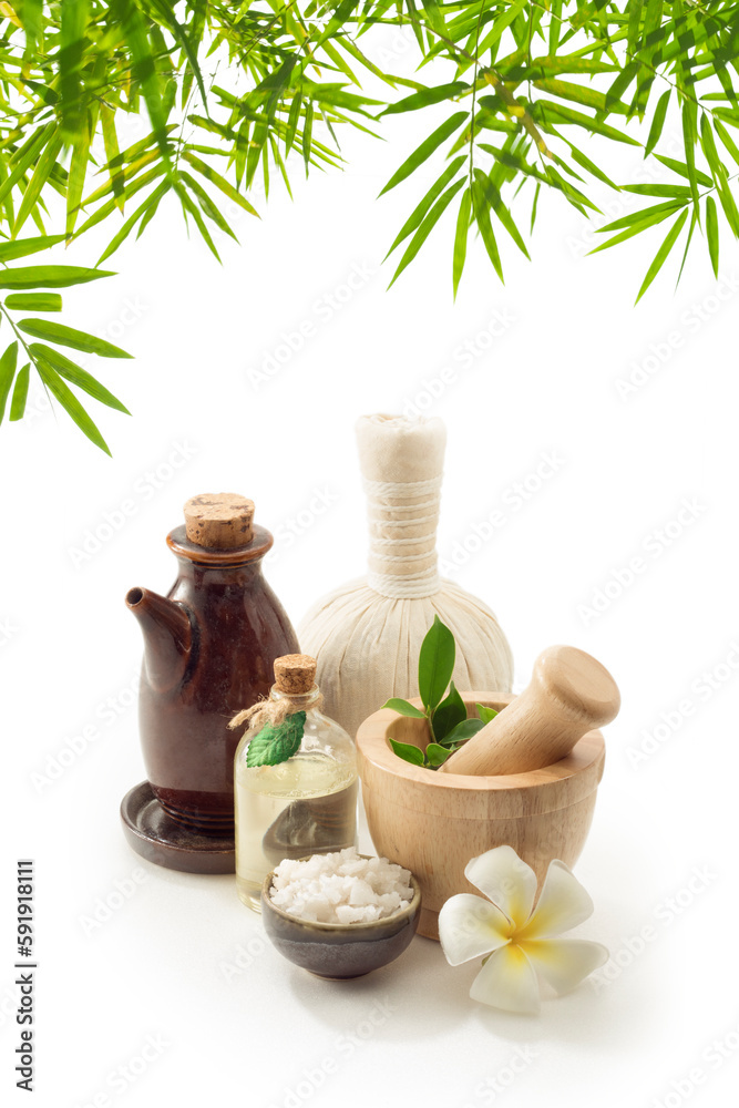close up view of mortar, salt, oil and Herbal Compress on white back. close up view of mortar, salt, oil and Herbal Compress on white back.