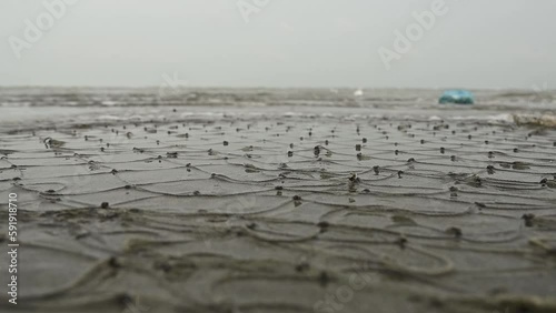 fishing net lying in the sea shore photo