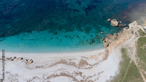 aerial view of the crystalline waters of the sea of ​​is arutas and mari ermi beach in sardinia 